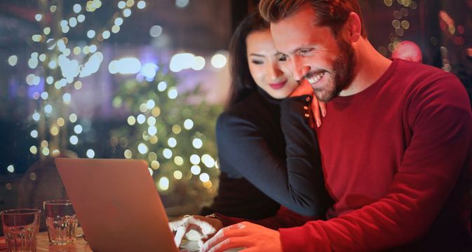 a man and a lady playing online casino