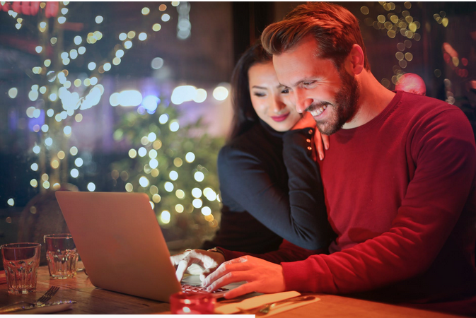a man and a lady playing online casino